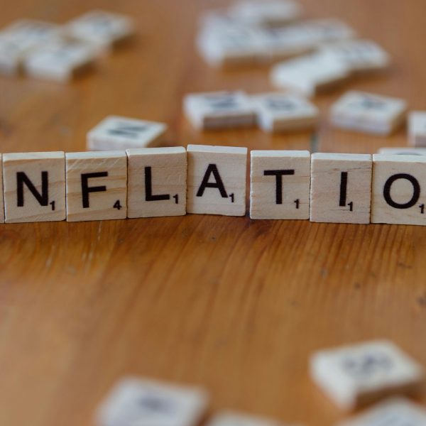 scrabble tiles arranged to spell the word "inflation"