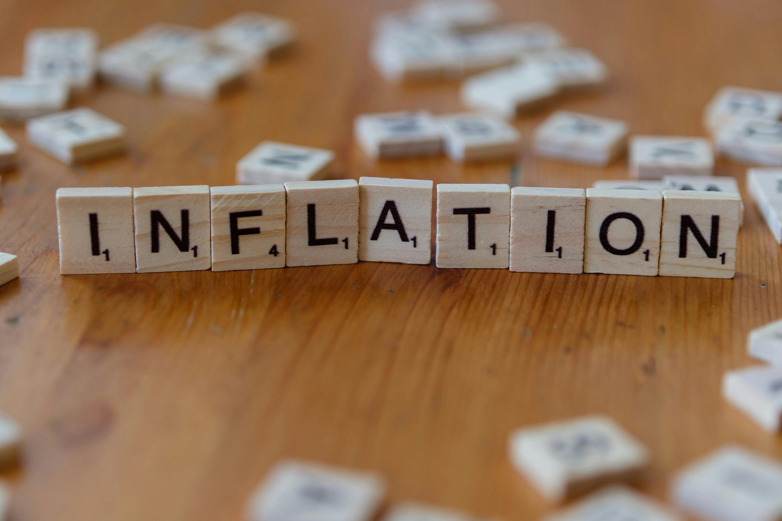 scrabble tiles arranged to spell the word "inflation"